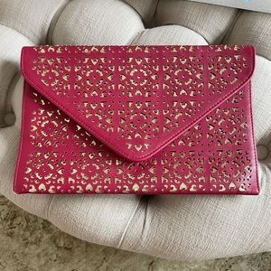 Large red leather cutout clutch with gold underlay